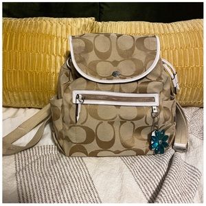 Coach backpack purse. Tan with purple interior. Great condition. Super cute!